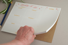 Load image into Gallery viewer, Weekly planner notepad with notes. 50 tear off pages, Runs Monday to Friday with a section for the weekend. 70 pound paper, lined with pink stars.