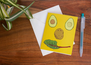 Happy face greeting card. Blank colourful avocado note card.