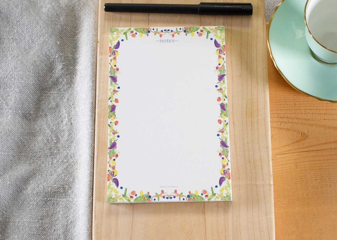 small white decorative notepad. Illustrated notepad with colourful fruits and veggies. 50 page pad for notes.
